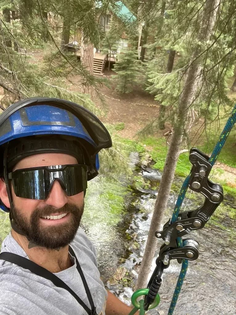 Nick Dufur, owner of Eagle Tree Service, on the job in arborist climbing gear